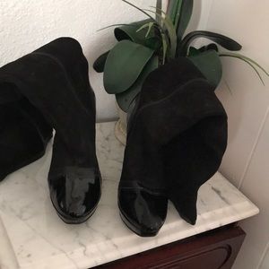 They are black heeled boots with a 5 inch tall